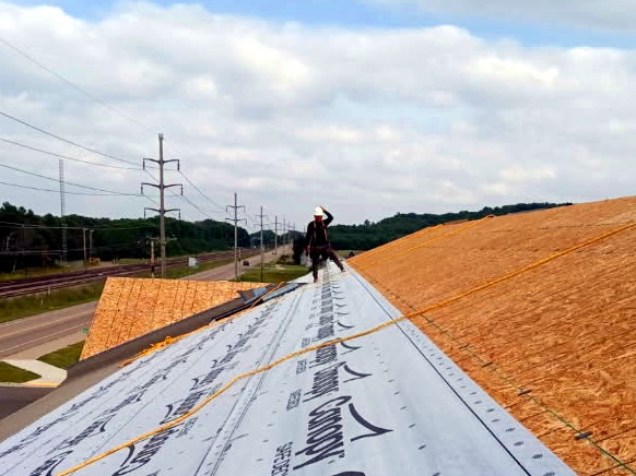 One of our roofing professionals working on a residential roof